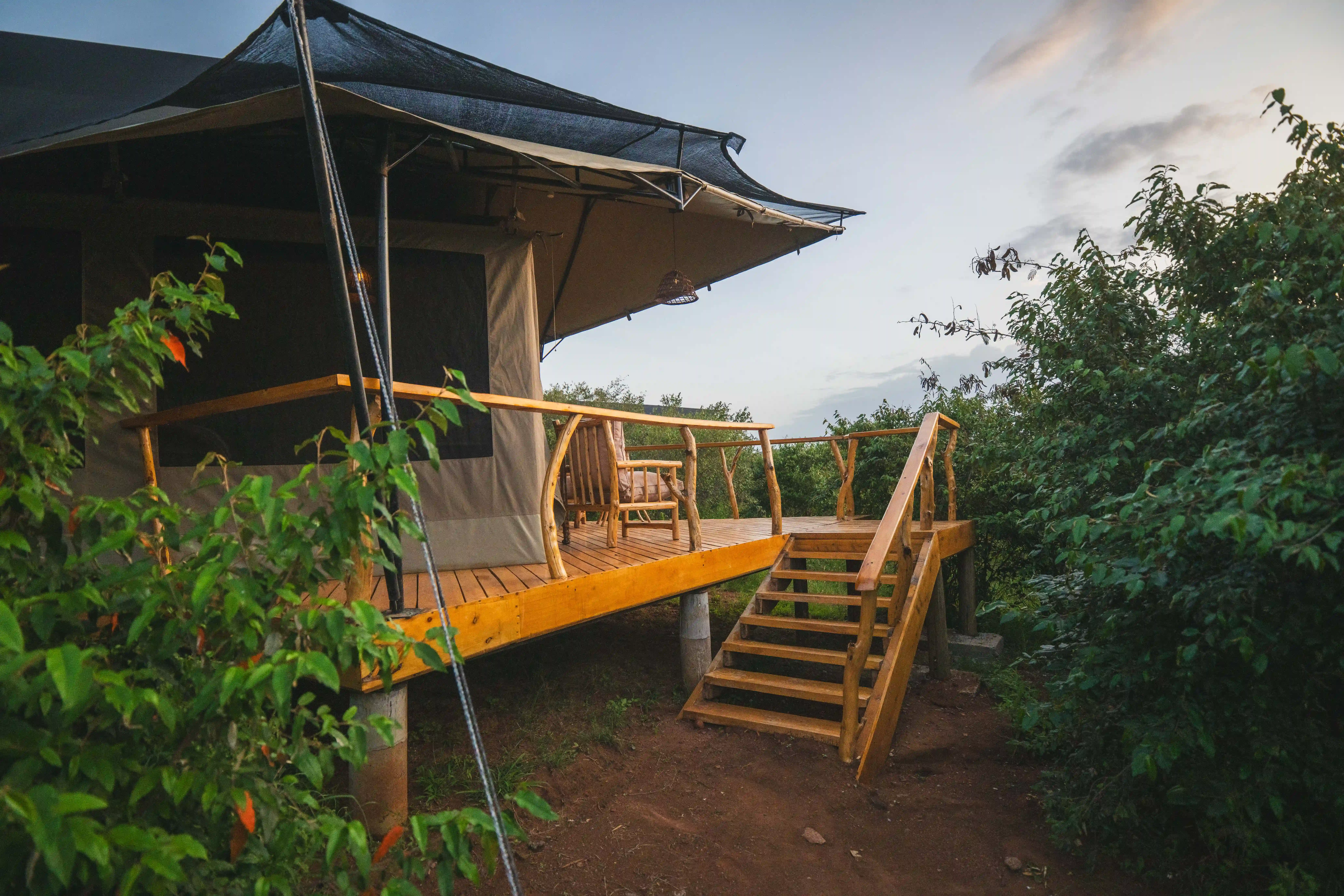 Luxury tent at golden hour with viewing platform extended.